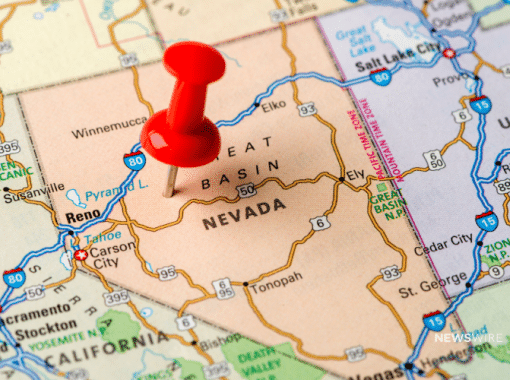 Picture of a map with a red push pin in the state of Nevada. Image is being used for a Newswire blog post about the top media outlets in Nevada.