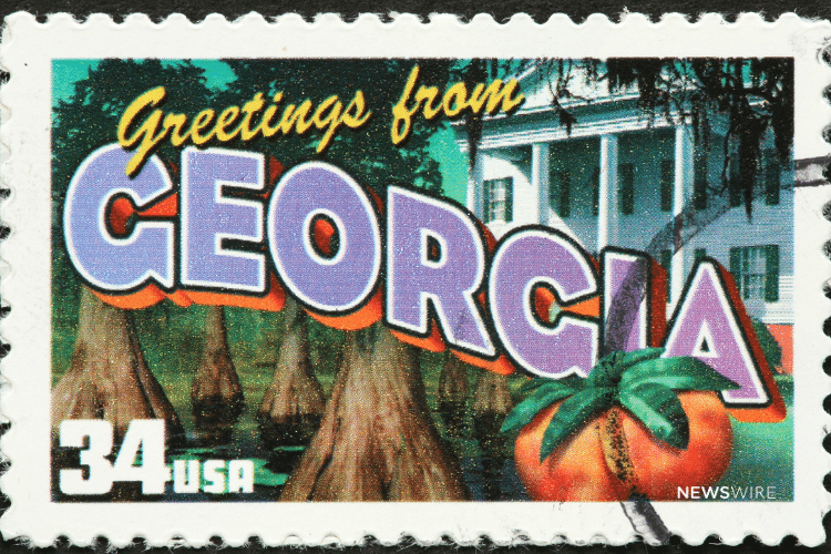 Picture of a "Greetings from Georgia" stamp. Image is being used for a Newswire blog post about the top media outlets in Georgia.