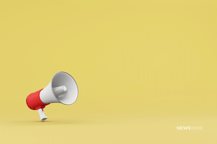 Picture of a white and red megaphone on a yellow background. Image is being used for a Newswire blog about three press release promotion ideas.