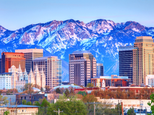 Picture of the Salt Lake City, Utah skyline with a mountain range in the backdrop. Image is being used for a Newswire blog post about the top media outlets in Utah.