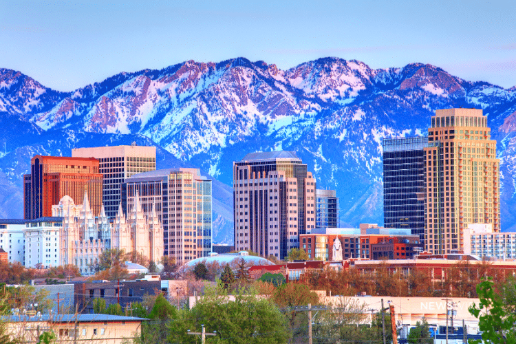 Picture of the Salt Lake City, Utah skyline with a mountain range in the backdrop. Image is being used for a Newswire blog post about the top media outlets in Utah.